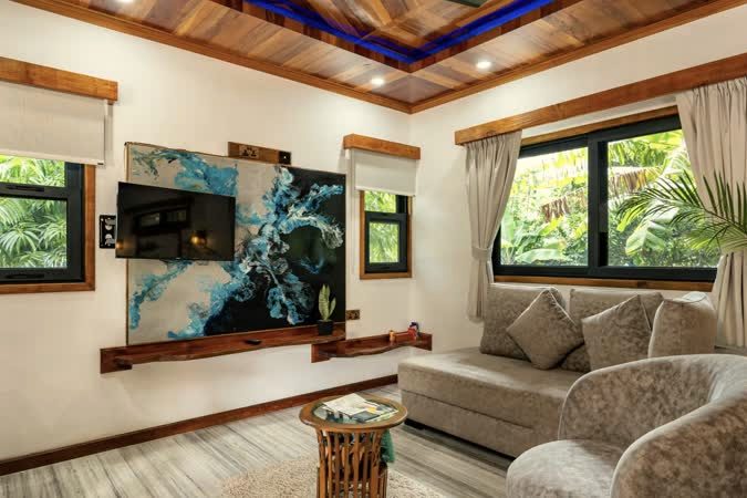 The living space of the Janmalac studio at Alibel Beach Villa, hand-built in reclaimed timber