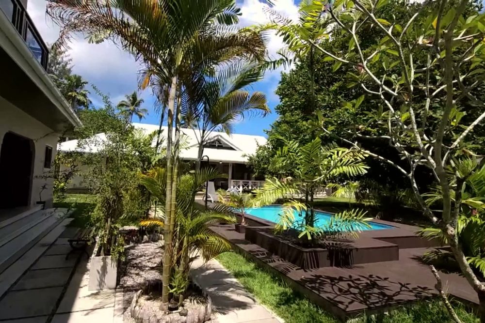 The swimming pool seen from the veranda of the Orange poolside studio at Alibel Beach Villa