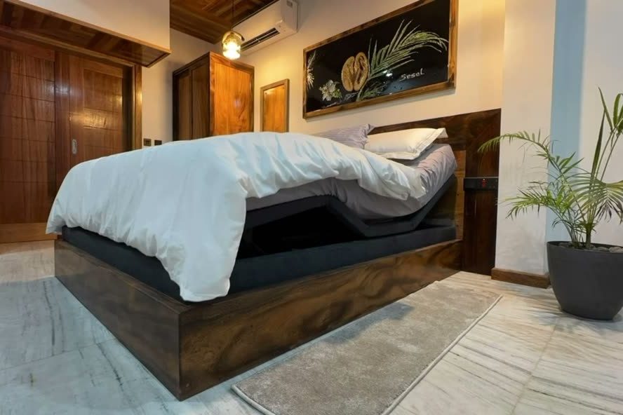 The queen recliner and massage bed in the step-free Palm studio at Alibel Beach Villa