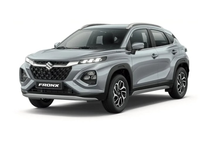 Silver Suzuki Fronx compact SUV, front three quarter view on a plain studio ground