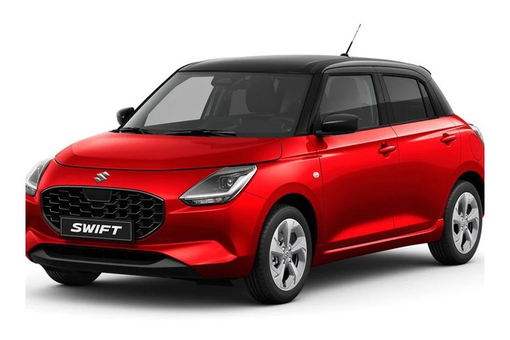 Red Suzuki Swift hatchback with a black roof on a plain studio ground
