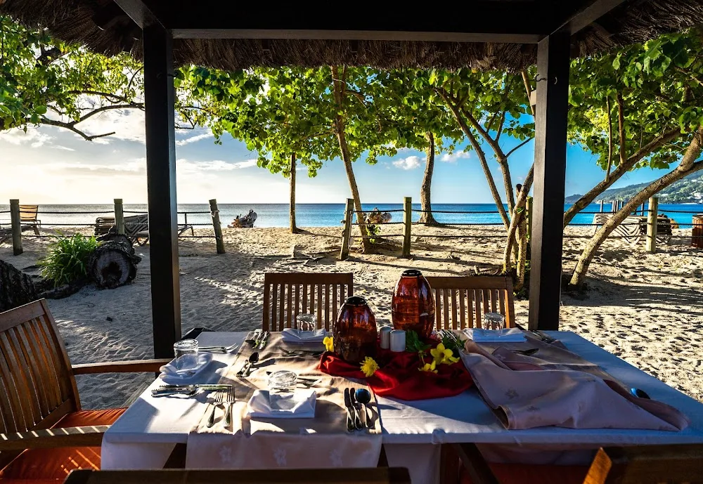STORY Seychelles, Mahé. A view of the beach.