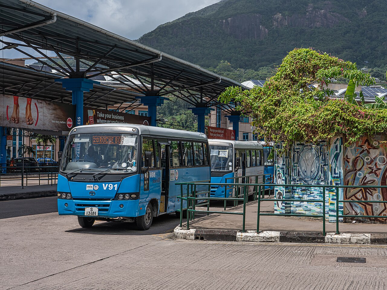 A Tata bus at the Victoria bus terminal with an India sticker in the colours of the Indian flag on its front panel.