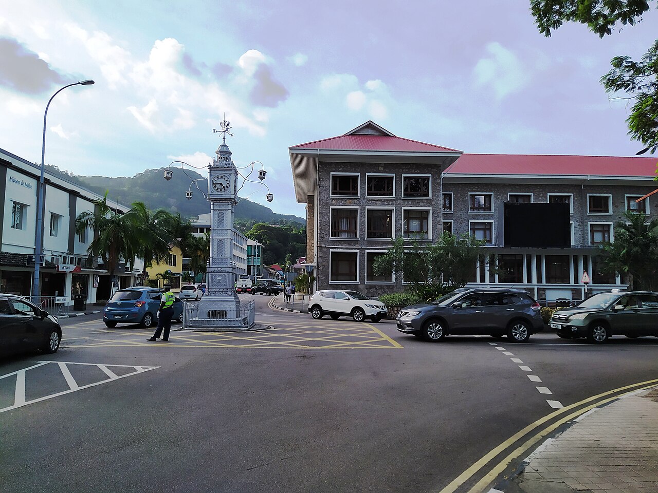 The Victoria clock tower and the stone facade of Liberty House at the crossroads in the centre of the Seychelles capital.