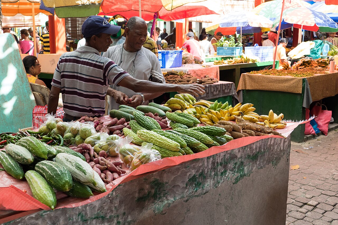 Vendors and produce at the Victoria market.