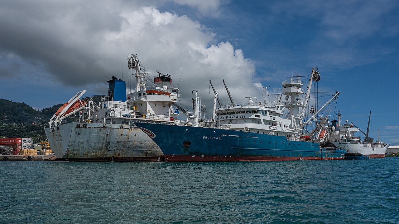 Tuna vessels lying alongside at Port Victoria under a bank of cloud.